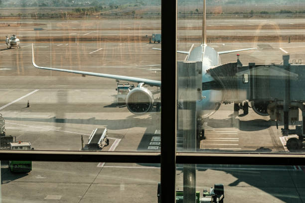 istock plane getting ready to welcome or send off passengers at the flight gate jet bridge 1842930863