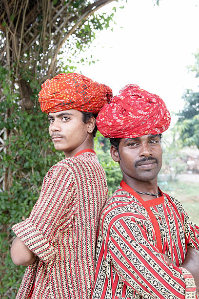 istock Two male Indian teenagers backs together 184293132
