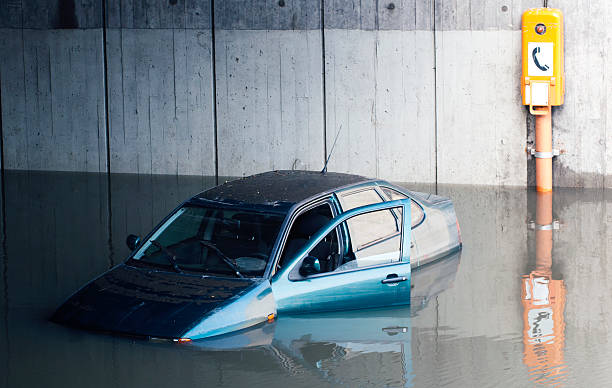 Car flooded right next to emergency phone stock photo