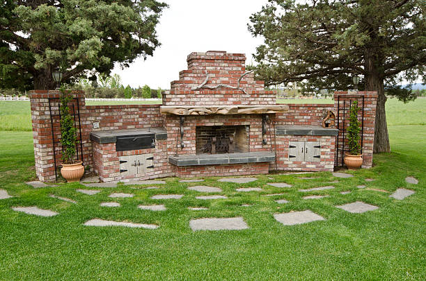 This outdoor barbecue is huge and made out of brick.