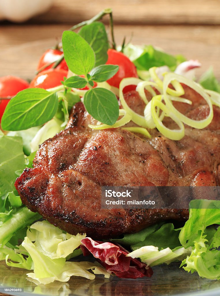 Grilled pork steak Grilled pork steak and salad Cooking Stock Photo