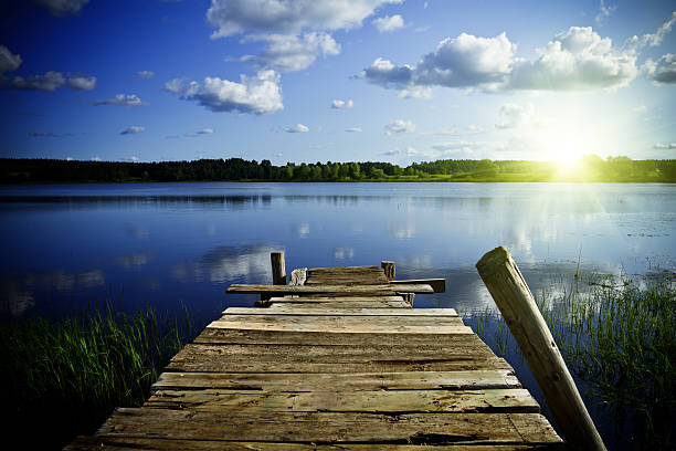 istock Old wooden pier at sunrise 184294048