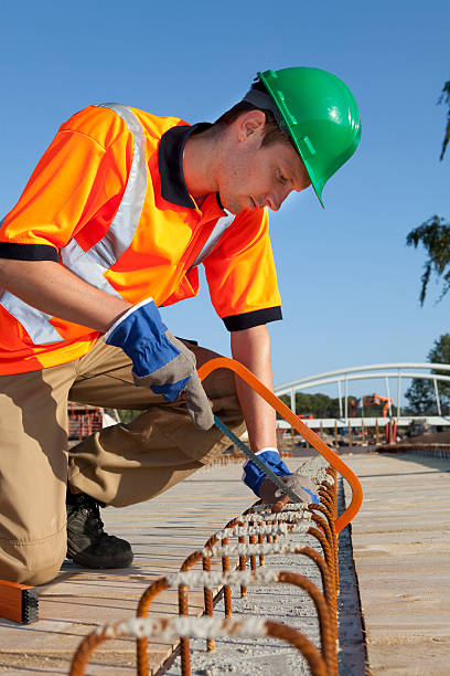 istock Manual worker busy with road construction. Building a bridge. 184294188