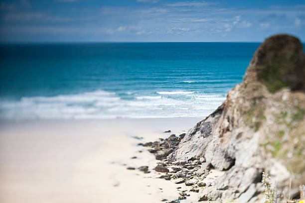 tilt and shift shallow focus, Whipsiderry beach, Newquay, Cornwall on a vibrant sunny June Day.