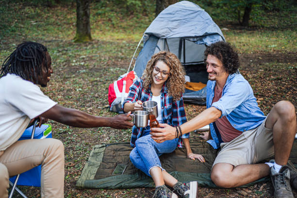 istock Friends camping in the forest together 1842944381