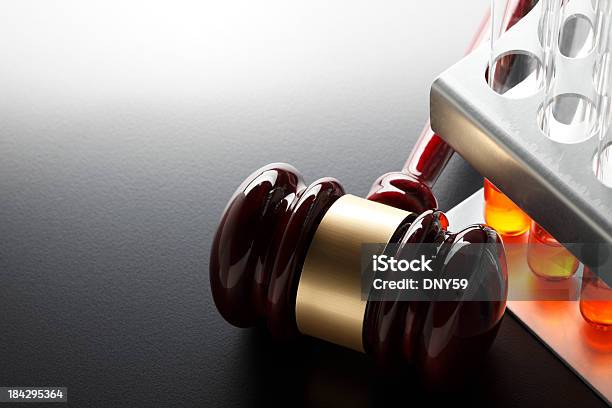Gavel Next To Test Tube Rack On Dark Gray Background Stock Photo - Download Image Now