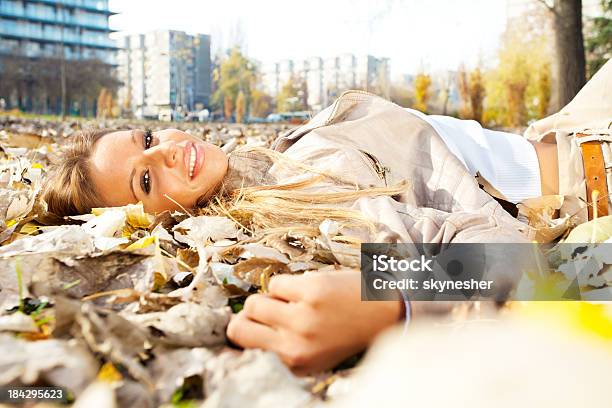 Attractive Brunette Enjoying In The Park Stock Photo - Download Image Now - Adult, Adults Only, Autumn