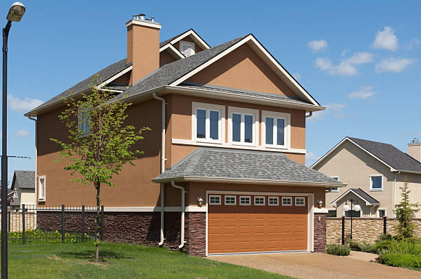 istock Brand new suburban house in sunny summer afternoon 184295708