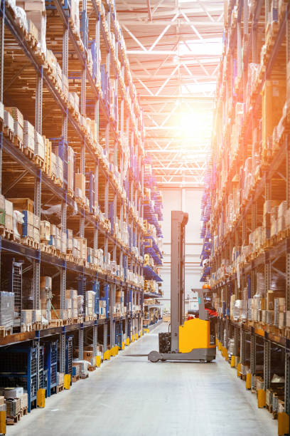 Forklift loader in Modern warehouse interior with shelves and boxes