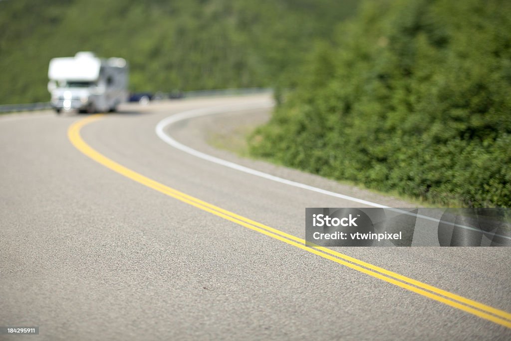 Summer vacations Camper on the twisty roads of the Cabot Trail in Nova Scotia, Canada. Shot with 5DII and 45mm TS lens, focus is on the foreground. Cabot Trail Stock Photo