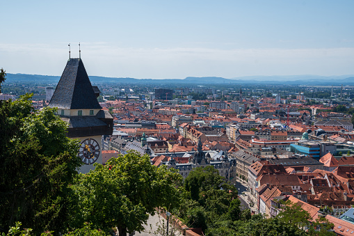 Graz, Austria - 7 17 2022: City scape of Graz from the Schlossberg with the Uhrturm