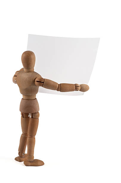 istock Wooden Mannequin holding blank sign 184296286