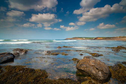 A beautiful summer day at Widemouth bay on the North Cornwall coast.