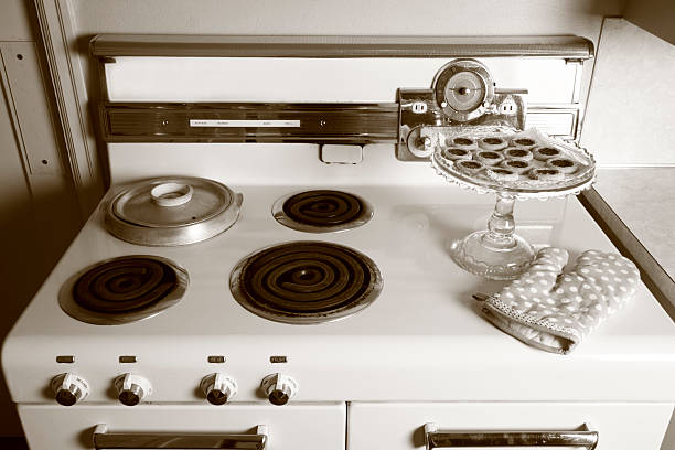Old electric stove on a white background.