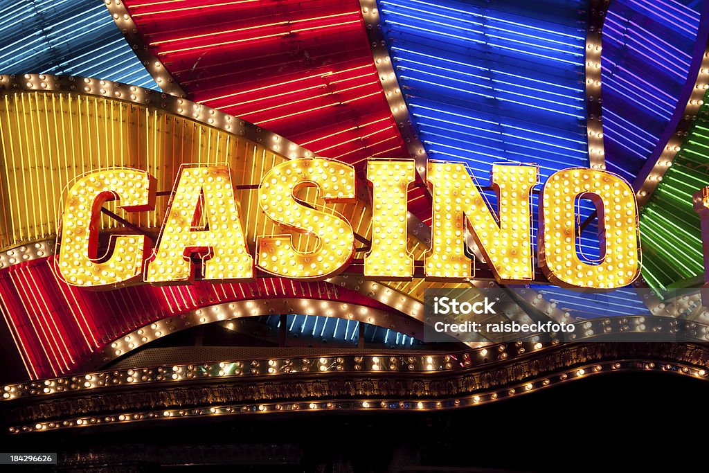 Casino Sign Bright casino sign lit with bulbs and neon lights. Casino Stock Photo