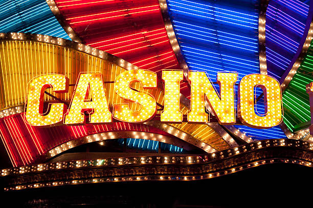 Casino Sign Bright casino sign lit with bulbs and neon lights. macao photos stock pictures, royalty-free photos & images