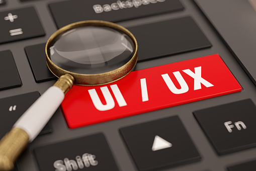 User Interface User Experience Concept UI/UX Key on Computer Keyboard with a Magnifier. 3D Render