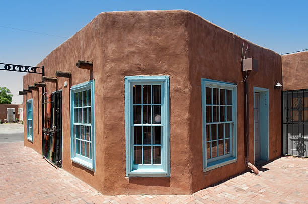 istock Santa Fe Adobe House with Stucco Wall and Blue Window 184296666