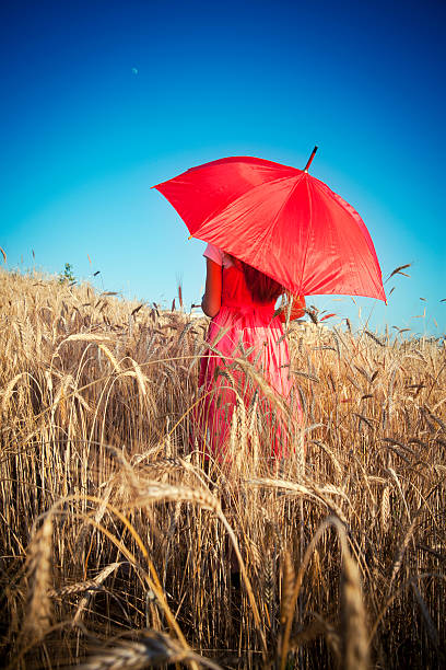 istock Young girl on grain field 184296938