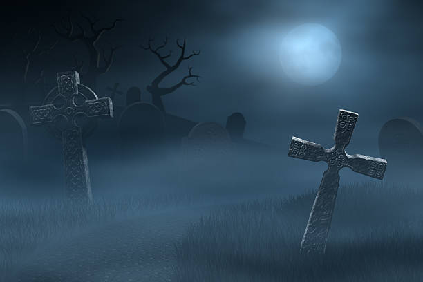 istock Tombstones on a spooky misty graveyard, full moon at night 184297110