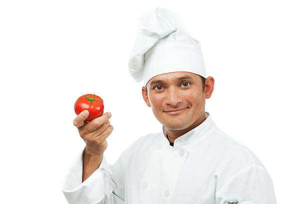 istock Happy Professional Chef Holding Tomato on White Background 184297286