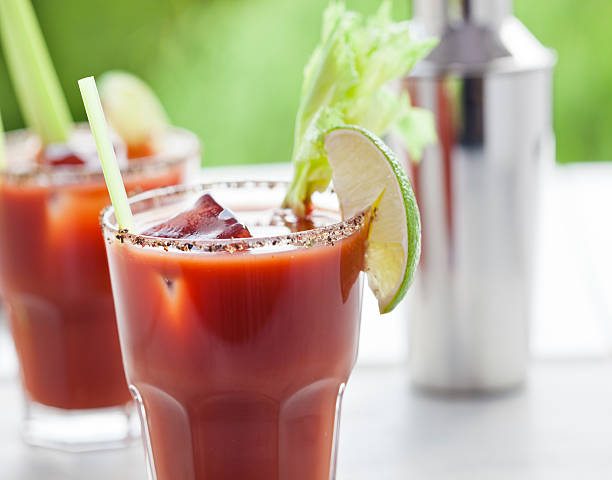 Bloody Mary or Caesar Cocktail  with Lime, Celery  and ice stock photo
