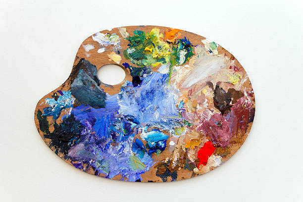 istock Wooden artist's palette with colorful paint leftovers 184297586
