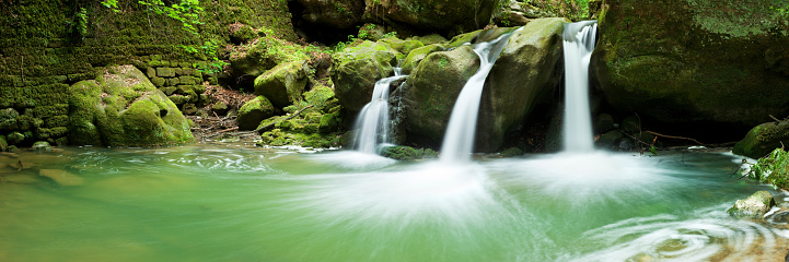 A panoramic image of three waterfalls flowing into a small plunge pool. A seamlessly stitched panoramic image with a total size of 87 megapixels.