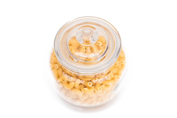 istock Uncooked Chifferi Rigati Pasta in Glass Jar Isolated on White 1842978624