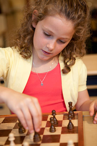 istock Little girl playing chess. 184297902
