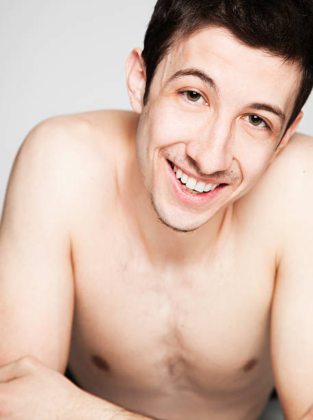 istock Shirtless man smiling close-up 184297999