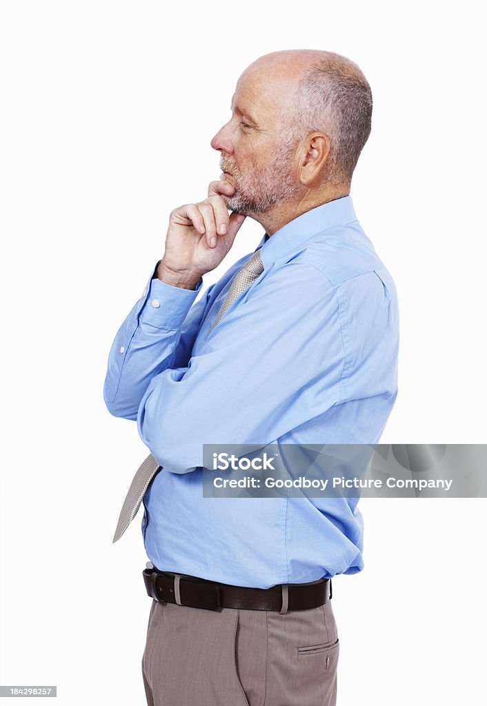 Observant business man Side view of a senior business man on white background Portrait Stock Photo