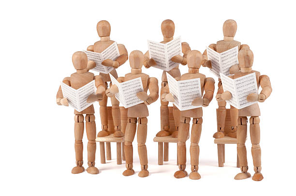istock wooden mannequin singing with sheet music 184298340