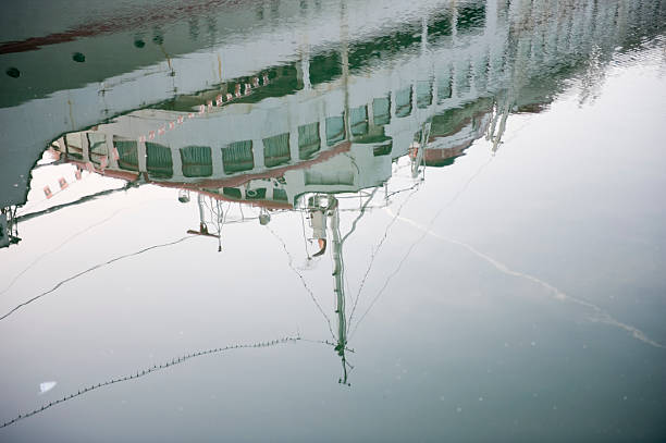 istock boat reflecting in water at sunrise 184298367
