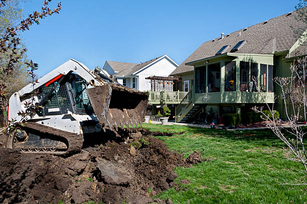 istock Bulldozer Scoops Dirt for a New Swimming Pool 184298572