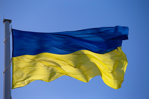 Flag of ukraine against the blue sky close-up. National pride and symbol of the country Ukraine. Yellow-blue flag.