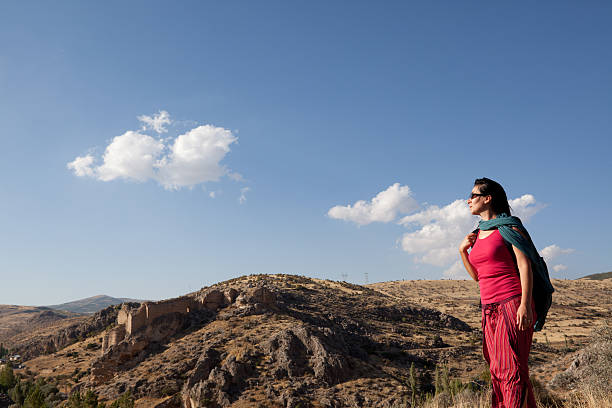 istock Young traveling woman with camera on journey 184299179