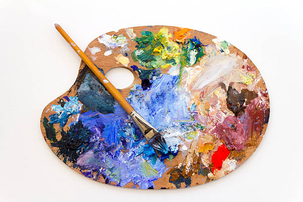 Vibrant multi-coloured artists traditional wooden oil paint palette and brush Vibrant multi-coloured artists oil paint palette--------------------Similar Images-------------------- oil paint palette stock pictures, royalty-free photos & images