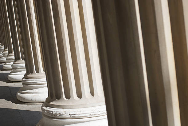 istock Sun Shines on Row of Fluted Columns 184299866