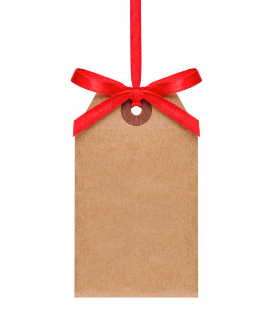 Empty paper tag isolated on white Hanging craft paper tag with red ribbon isolated on white background christmas present stock pictures, royalty-free photos & images