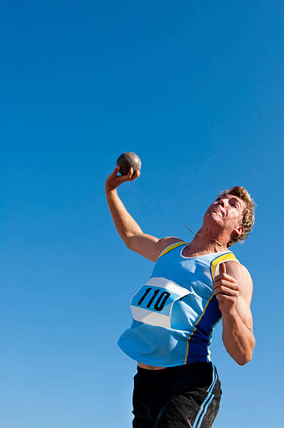 Athlete competes in shot put