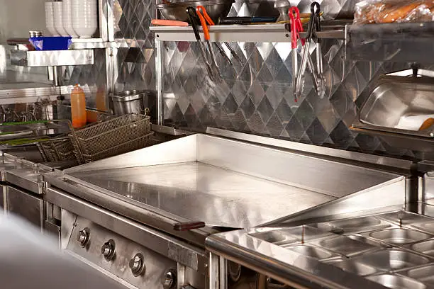 Hotplate cooker in  fast food restaurant kitchen