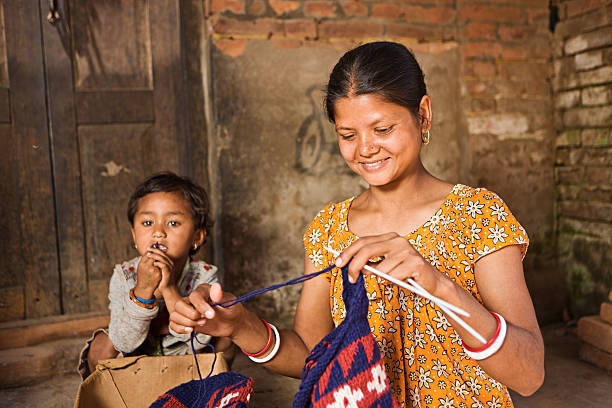istock Nepali woman knitting wool hat. Bhaktapur. 184300804