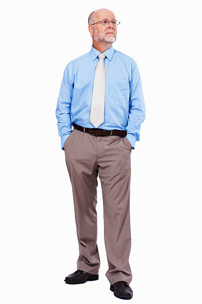 istock Confident, male executive standing with hands in pockets 184300816