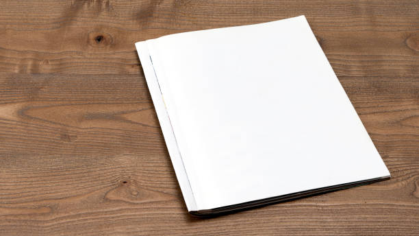 istock magazine page is open on wooden table 1843011723