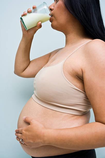 istock Pregnant woman drinking milk 184301791