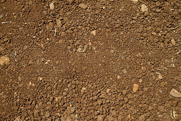 Close-up aerial view of coarse brown soil with no plant life Sand ground extreme terrain stock pictures, royalty-free photos & images