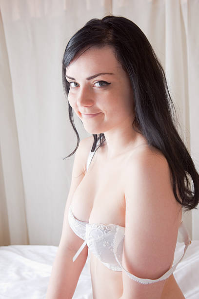 istock Semi Nude Girl On A Four Poster Bed 184301874