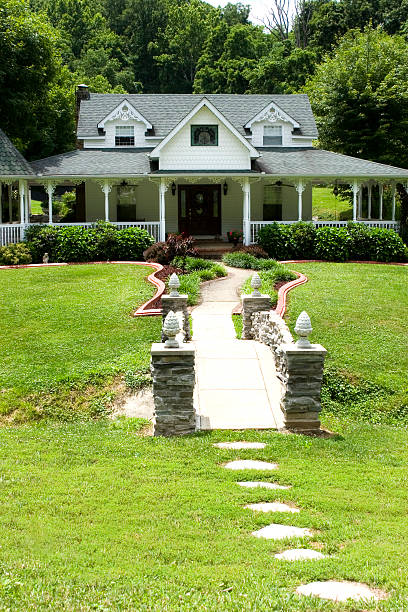 istock Beautiful country home with walkway bridge 184301892