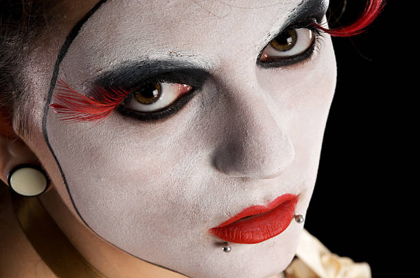 istock Closeup of model in painted white face. 184302515